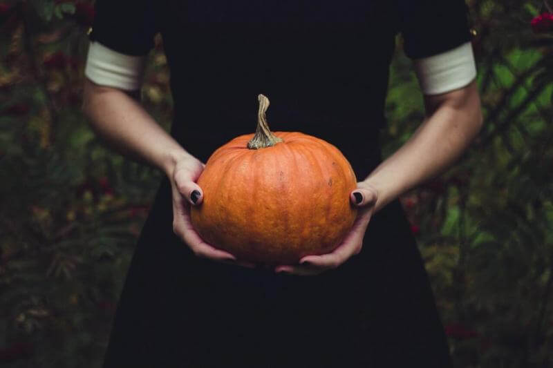 Girl with Halloween Pumpkin