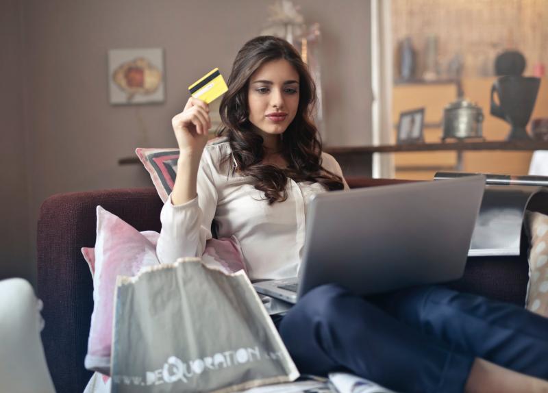 Lady Shopping Online Using a Gift Card