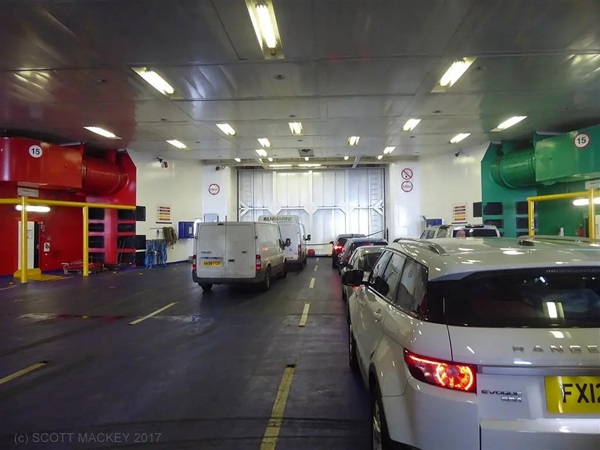 Vehicles boarding a ferry via the car loading deck